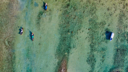 Overhead aerial view of Long Tail Boats on a beautiful topical Thailand beach