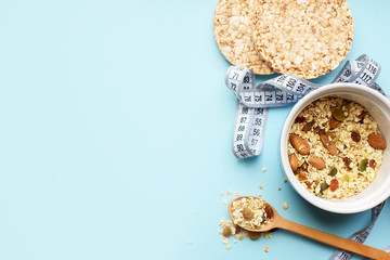 Useful breakfast, proper nutrition, oatmeal, dried fruits, breads, fruits, a centimeter on a light background. Diet. A place for text.