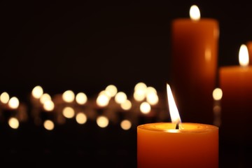 Candle black background of mourning funeral moment of silence	