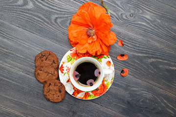 cup of coffee and red rose