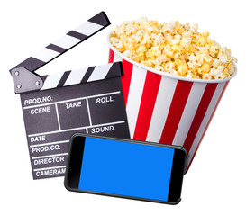 Flying popcorn, film clapper board and phone isolated on white background
