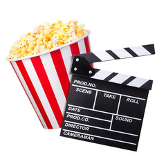 Flying popcorn and film clapper board isolated on white background