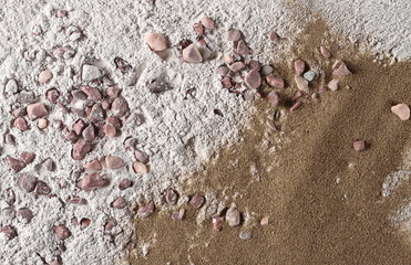 Dry cement, mortar pile, plaster with red rocks and sand surface background and texture