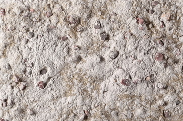 Dry cement, mortar pile, plaster with red rocks and sand surface background and texture