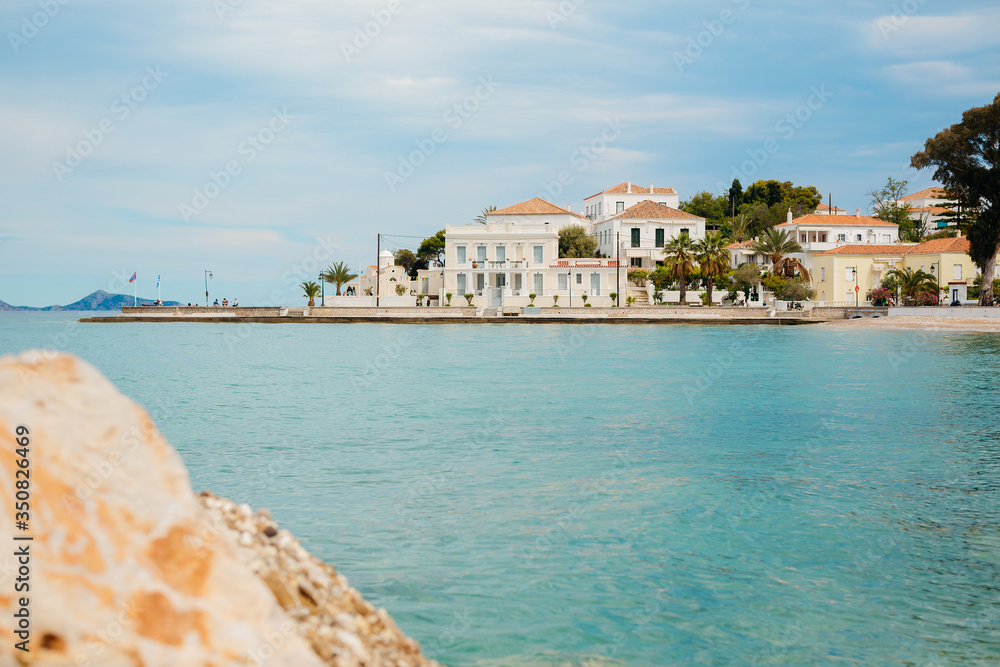 Wall mural Greek island Spetses, the embankment of the old town with beautiful houses on the sea