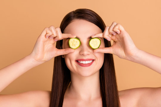 Close up photo of charming girlish lady close cove eyes with cucumber slice want effective natural skincare treatment mask make skin silky like after spa salon isolated over pastel color background