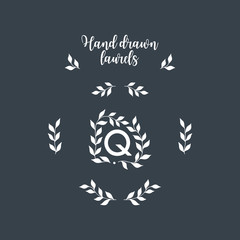 Set of hand drawn wreath and branches. Vector floral frame with "Q" letter. Elegant floral monogram for "Q".Vector floral elements.