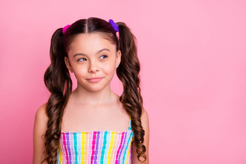 Photo of beautiful little lady model two lovely cute curly tails good mood look interested side empty space tricky wear colored dress summer singlet isolated pastel pink color background