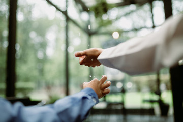 Kids catching raindrops. Soft focus.