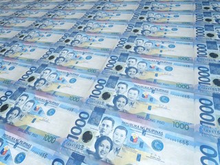 A background of neat rows of 1000 Philippine peso bills. Philippine currency. Paper money or...