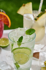 Assorted cocktail, lime, orange and pineapple. Summer concept.