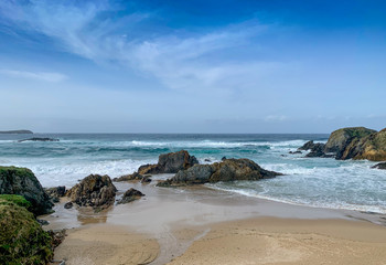 Fototapeta na wymiar The sea against the rocks on the beach of A Frouxeira
