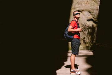 Fototapeta na wymiar Young male hiker with backpack. Active healthy lifestyle adventure journey vacations. photo with space for your montage