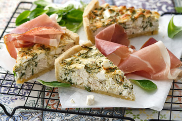 Homemade Cheesy Egg Quiche for Brunch with Spinach and jamon.