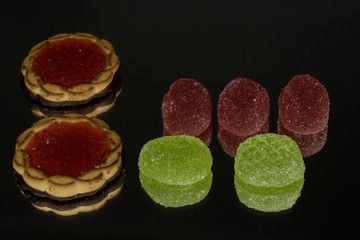 Several marmalade sweets isolated on a black background