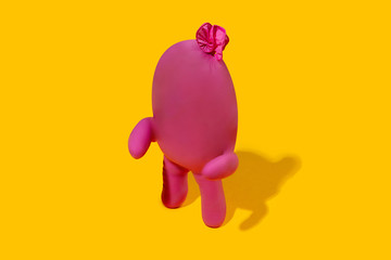 Life of rubber glove - protective wear isolated on yellow studio background with copyspace for ad. Must have during pandemic, epidemic, for protection and cleaning. Funny look from the inside.