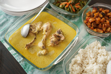 opor ayam and sambal goreng hati . indonesian traditional food during eid mubarak celebration