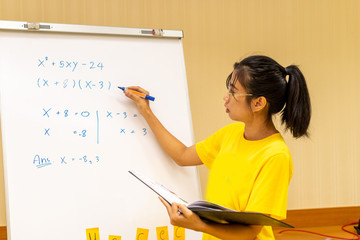 Asian teacher teaches math with white board at home, study at home