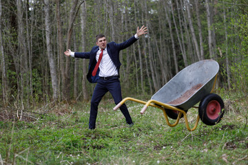 The businessman throws the cart with anger. anger and annoyance of man. nervous breakdown of a man in a business suit.