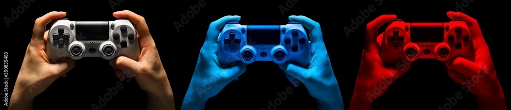 Wall mural set of hands holding video game gamepad in neon lights isolated on a black