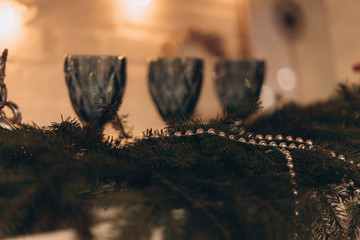 blue glasses against the background of a New Year's garland