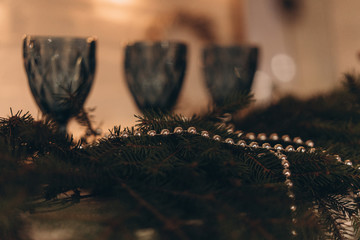 blue glasses against the background of a New Year's garland