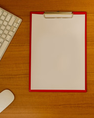 Working table with note paper and accessories on the wooden table background. View from above.