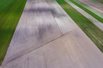 Drought season in Poland, drone view of plowed and won fields in Jaczew, small village in Mazowsze region of Poland