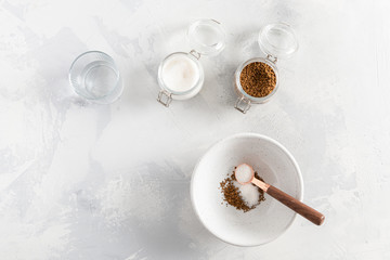 Dalgona coffee cooking step by step recipe. Step 3. Adding sugar to the bowl on white background. Top view