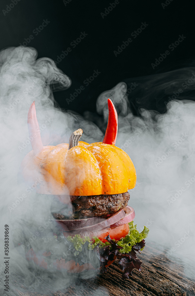 Wall mural jack lantern burger. halloween tasty and unusual burger concept