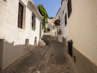 Narrow street in the old town of Capileira, Spain 