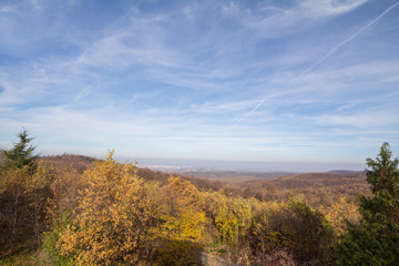 Panorama of Fruska gora mountains, from a top of a hill, with mounts covered with trees wih yellow leaves, typical from Autumn. Fruska Gora is a national park of wood and forest in Vojvodina, Serbia