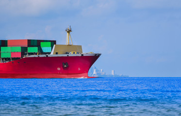 Front view of a large shipping container ship International Container Cargo ship sailing in the Ocean, Freight Transportation, Shipping, Nautical Vessel.