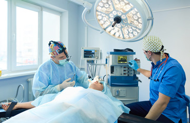 Man surgeon at work in operating room