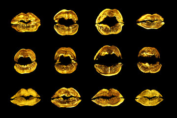 Golden lipstick kiss print set black background isolated close up, yellow sexy lips mark makeup...