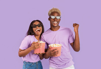 Black guy and his girlfriend with 3D glasses and popcorn going to movies on lilac background