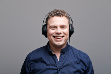 Studio portrait of rocker musician in headphones