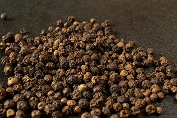 spices, pepper close-up on black background