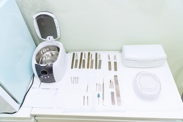 Tools for hardware manicure. Cutters and files. Place for disinfection of tools