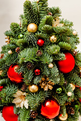 cristmas handmade tree made of fir decorated with balls