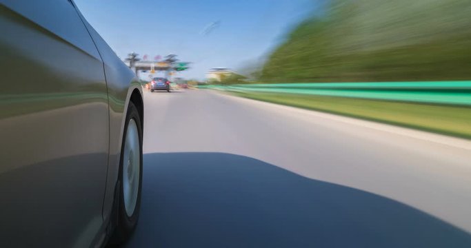 time lapse of car driving on road with speeding motion blur