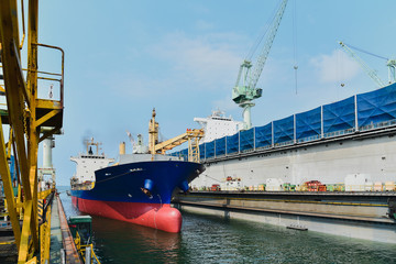 Ship for repair in large floating dry dock.
