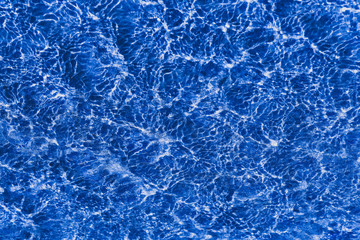  Blu water in swimming pool rippled water detail background