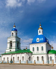 Fototapeta na wymiar Orthodox Church against the blue sky with clouds