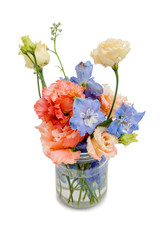 several flowers (blue, orange-yellow) in a glass jar with water