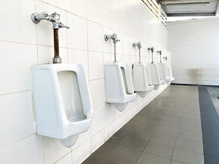 Men's white urinals design, Close up row of outdoor urinals men public toilet, Urinal concept.