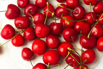 red fresh cherry close-up on a white background
