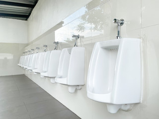 Men's white urinals design, Close up row of outdoor urinals men public toilet, Urinal concept.