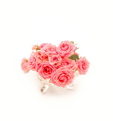 pink roses in a glass jar