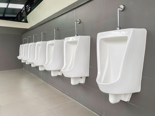 Men's white urinals design, Close up row of outdoor urinals men public toilet, Urinal concept.